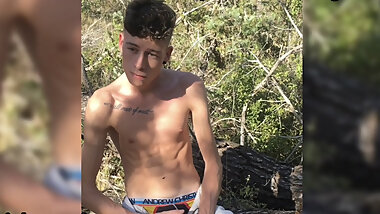 Skinny twink Craig Kennedy strips down and shows his big dick in a public forest