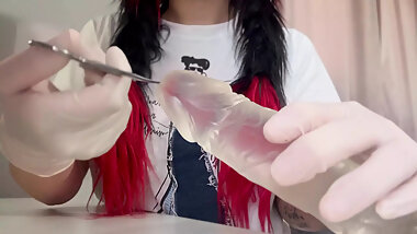 I play with the dildo in tight, white medical gloves