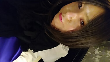 A cross-dressing boy in a black dress wore black full-body tights on the inner layer and purple full-body tights over it, making him look like a mascot character.