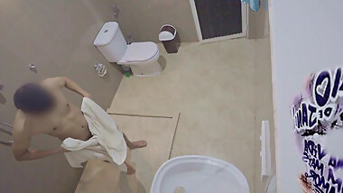 Asian boy enjoying a refreshing shower